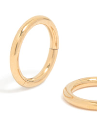 Crafted from gold plated titanium, these 6MM thick sleeper hoop earrings feature chunky styling close up view - link has visual effect only