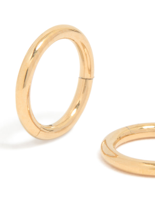 Crafted from gold plated titanium, these 6MM thick sleeper hoop earrings feature chunky styling close up view