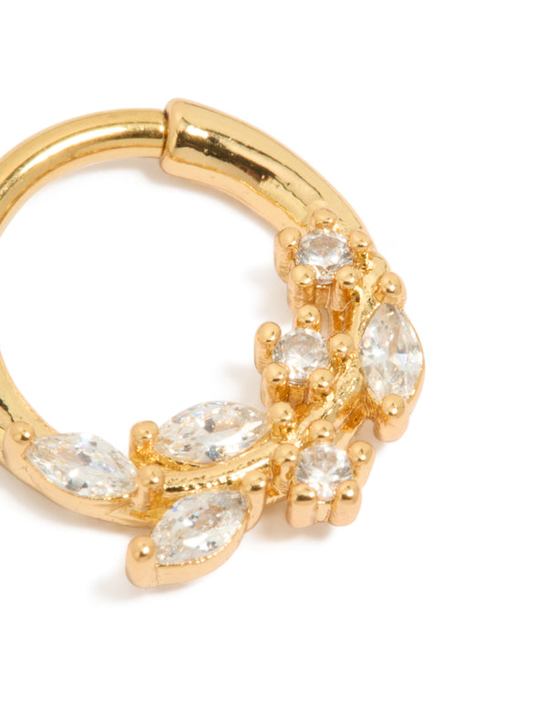 Featuring a vine-inspired floral pattern with marquise and round cut cubic zirconia, this gold plated titanium clicker ring is captured in detail view