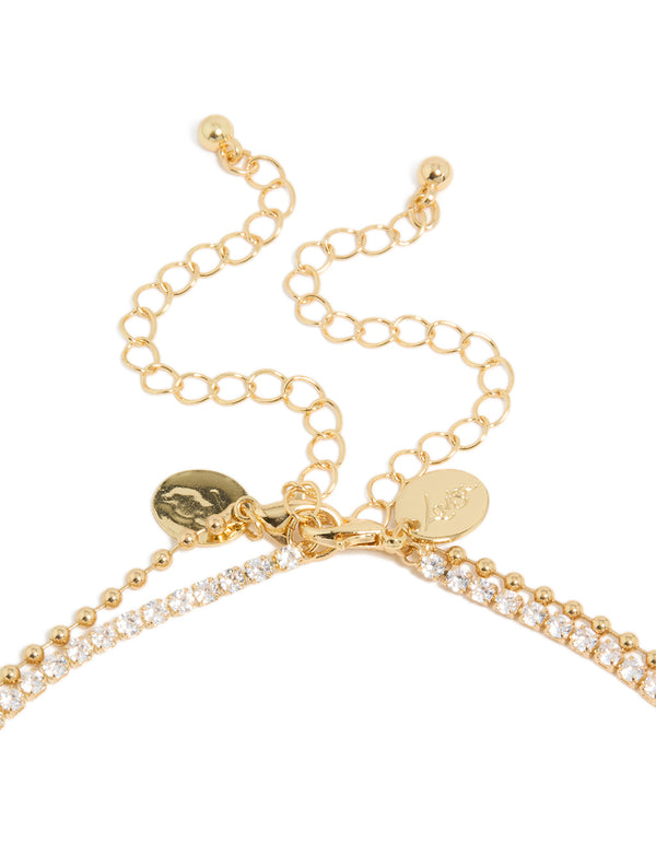 Elegant gold plated cubic zirconia tennis and droplets layered necklace with balls clasp detail view