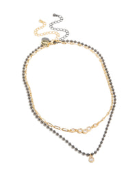 Explore mixed metal plated cubic zirconia teardrop and cluster layered necklace with balls and crystal in gold close up view - link has visual effect only