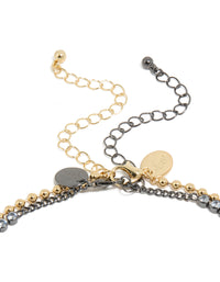 Detailed view of mixed metal plated cubic zirconia double layered tennis ball chain necklace and adjustable gold clasp detail view - link has visual effect only