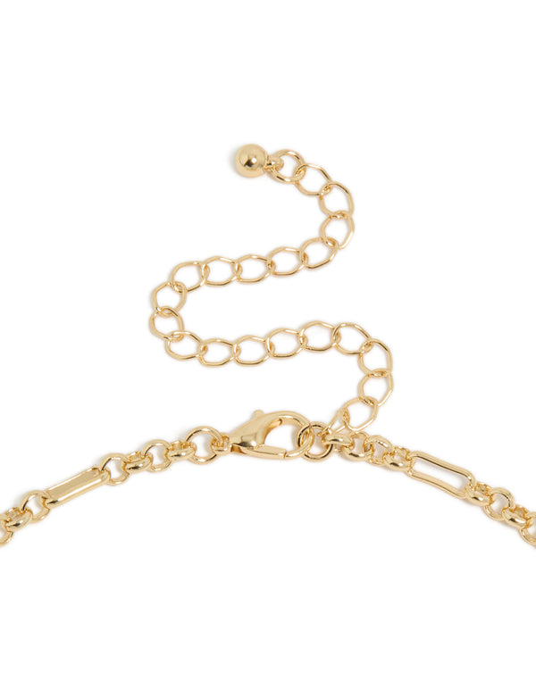 Showcasing mixed metal plated diamante cluster drop necklace with charm balls, cubic zirconia, and statement gold design clasp detail view