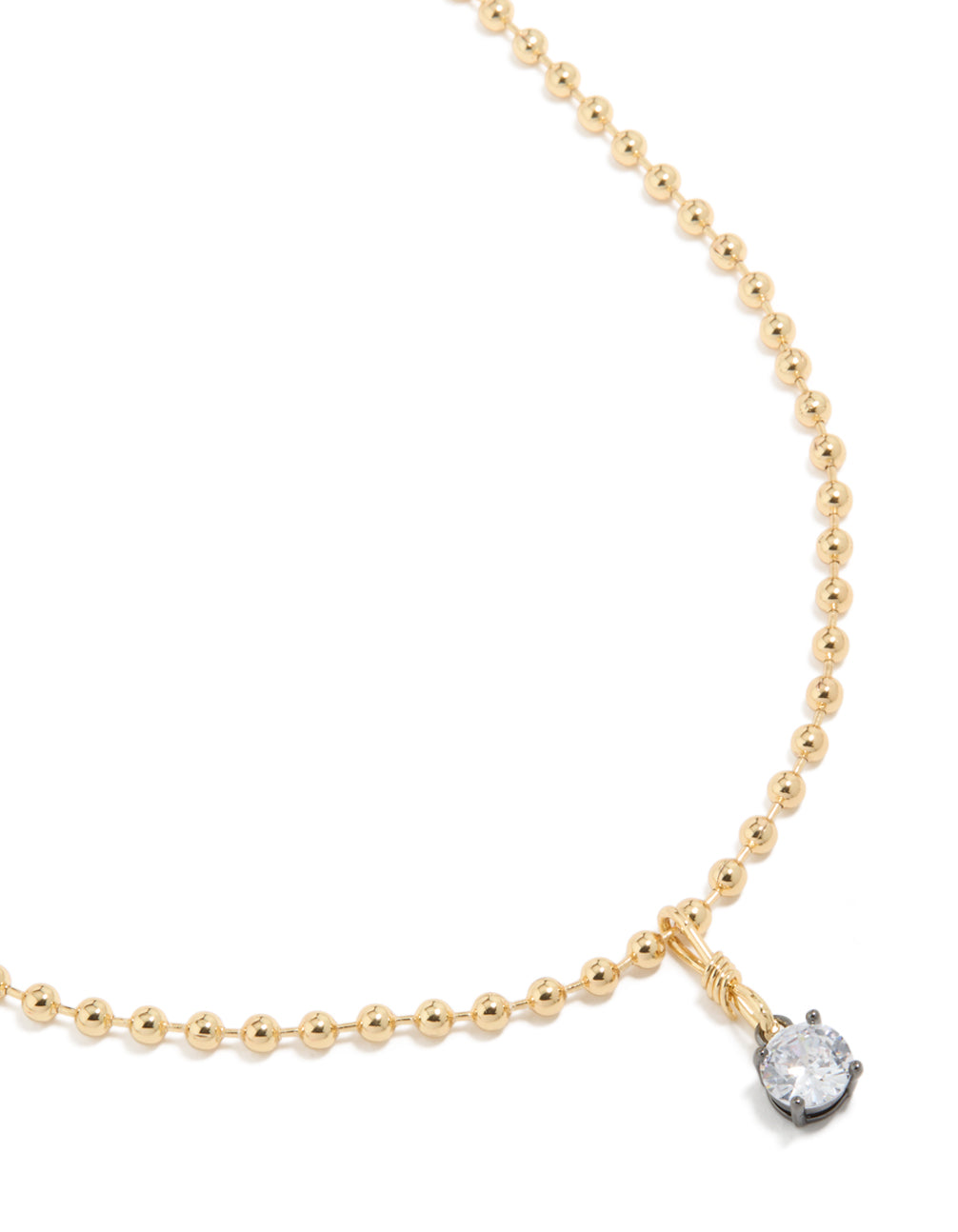 Showcasing a mixed metal plated cubic zirconia pendant and ball chain necklace with crystal in gold close up view