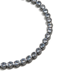 Featuring gunmetal silver plated cubic zirconia circle tennis bracelet close up view - link has visual effect only