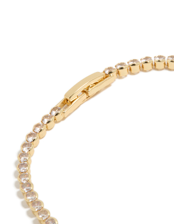Featuring gold plated tennis bracelet with oval cubic zirconia stones closure detail view