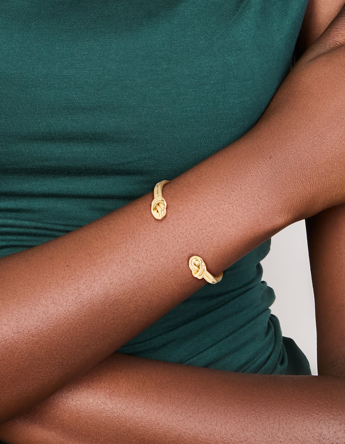 Featuring a gold plated double knotted centre wrist cuff with dainty styling on wrist view