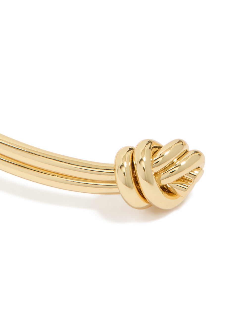 Highlighting the gold plated double knotted centre wrist cuff with dainty finish close up view