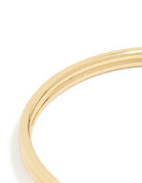 Highlighting the gold plated double knotted centre wrist cuff with statement styling closure detail view - link has visual effect only