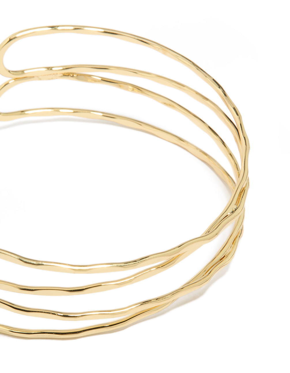 Showcasing gold plated multi cross textured arm cuff with statement design close up view