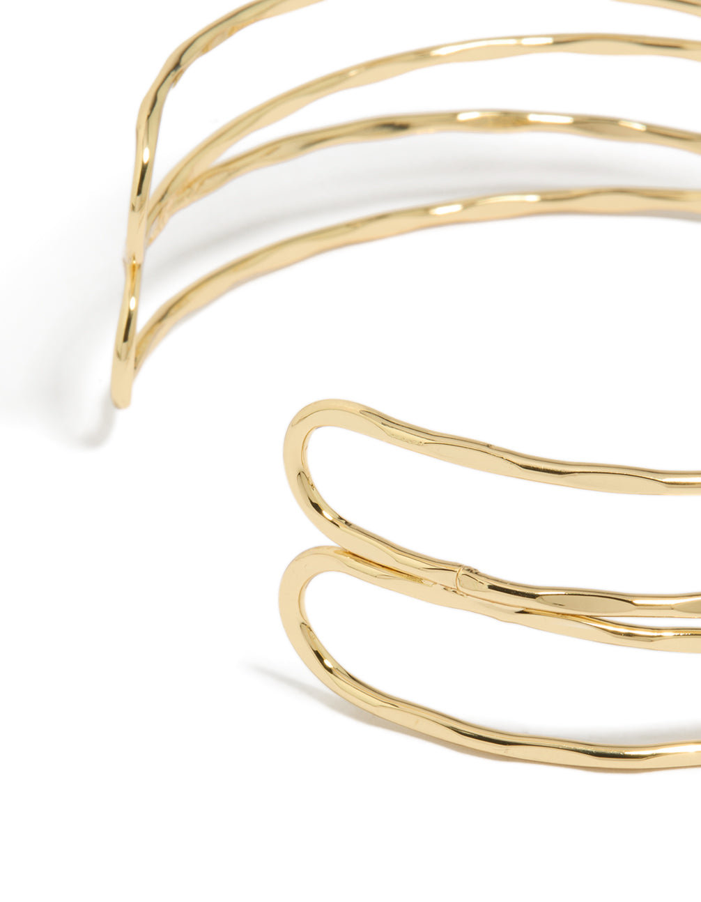 This gold plated multi cross textured arm cuff in statement style displays closure detail view