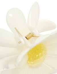 Crafted with a glossy daisy flower claw clip featuring in ivory, yellow detail view - link has visual effect only