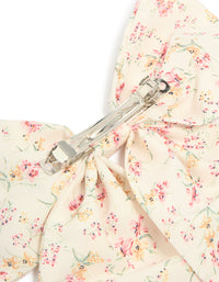 Floral printed fabric bow clip with leaf accents detail in ivory, light pink, peachpuff, and pale green showcasing clasp mechanism detail view - link has visual effect only