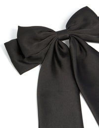 Featuring a bow design in solid black this hair clip side view - link has visual effect only