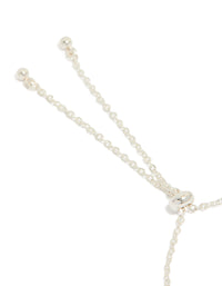 Showcasing the silver plated oval and round cubic zirconia tennis toggle bracelet closure detail view - link has visual effect only