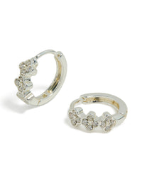 Discover these dainty waterproof stainless steel cubic zirconia triple flower huggie earrings with crystal details in silver front view - link has visual effect only