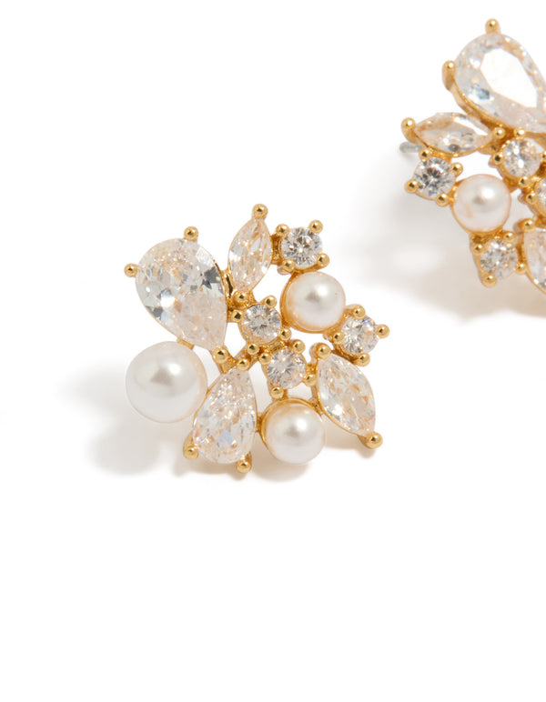 Showcasing gold plated cubic zirconia and pearl cluster stud earrings close up view