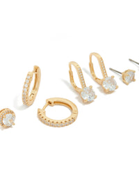 Showcasing gold plated cubic zirconia mixed stud and huggie earrings in a 4-pack with crystal details and huggie closures post detail view - link has visual effect only