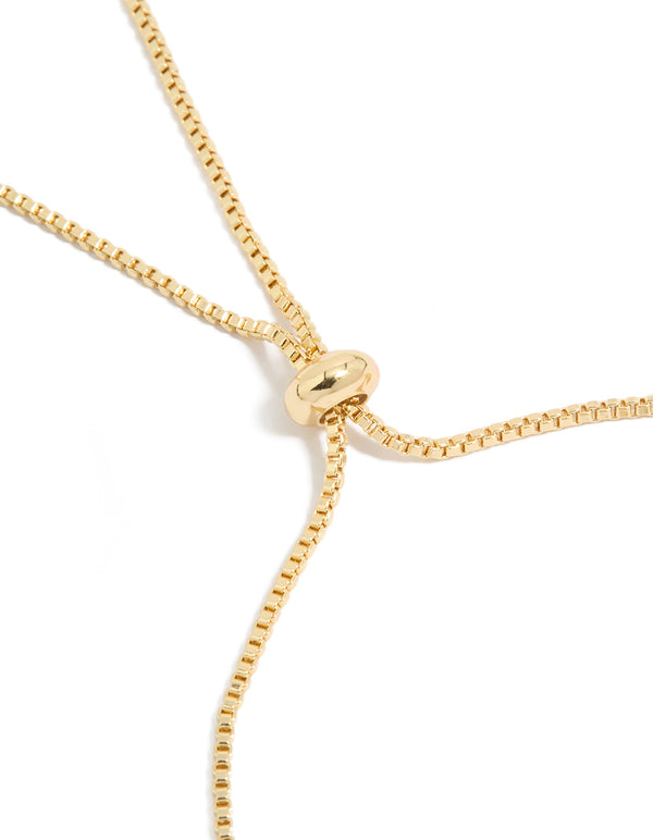 Sophisticated gold plated toggle bracelet with cubic zirconia and floral ivory closure detail view