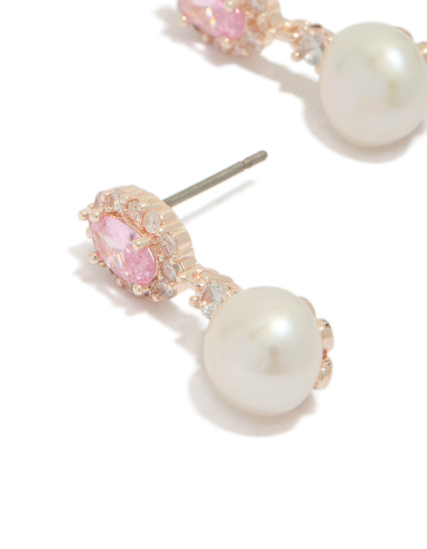 Elegant rose gold plated cubic zirconia freshwater pearl halo drop earrings with statement design close up view