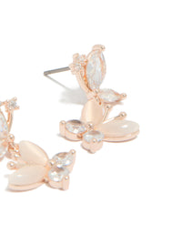 Beautiful drop earrings with double butterfly charm featuring cubic zirconia in rose gold plated finish post detail view - link has visual effect only