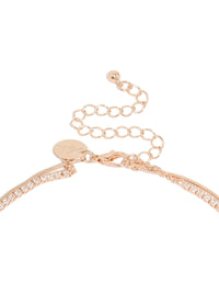 Highlighting a rose gold plated cubic zirconia cup chain and snake layered Y-necklace with crystal accents clasp detail view - link has visual effect only