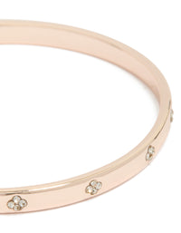 Featuring a rose gold plated diamante flowers bangle close up view - link has visual effect only