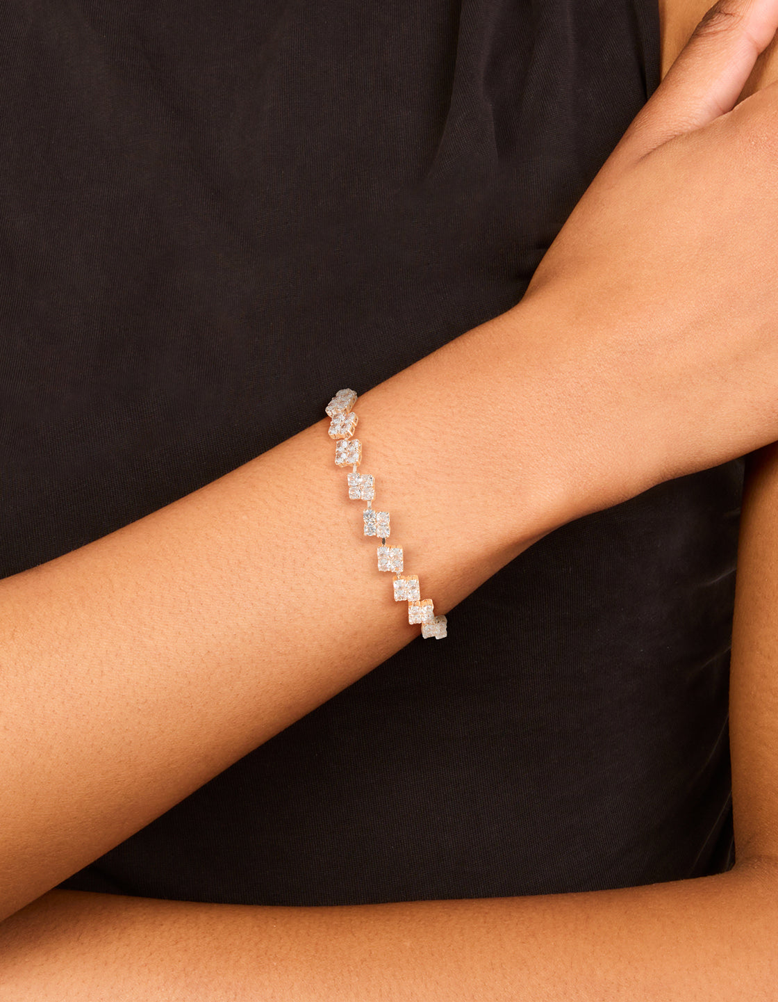 Elegant rose gold plated cubic zirconia flower detail toggle bracelet on wrist view