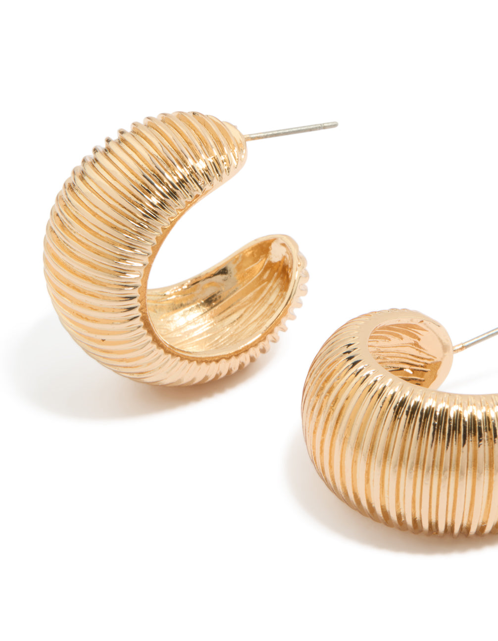 Featuring gold wide strap hoop earrings with statement style close up view