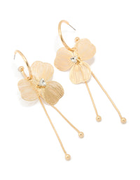 Showcasing statement style laser cut flower drop earrings in gold front view - link has visual effect only