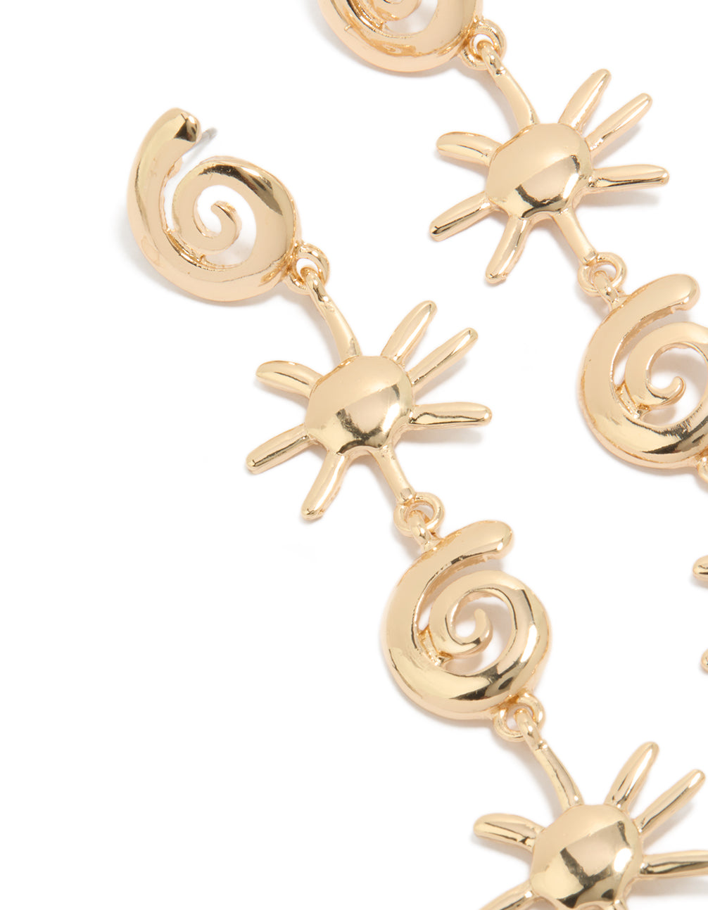 Featuring gold shell and sun drop earrings with statement celestial charm design close up view