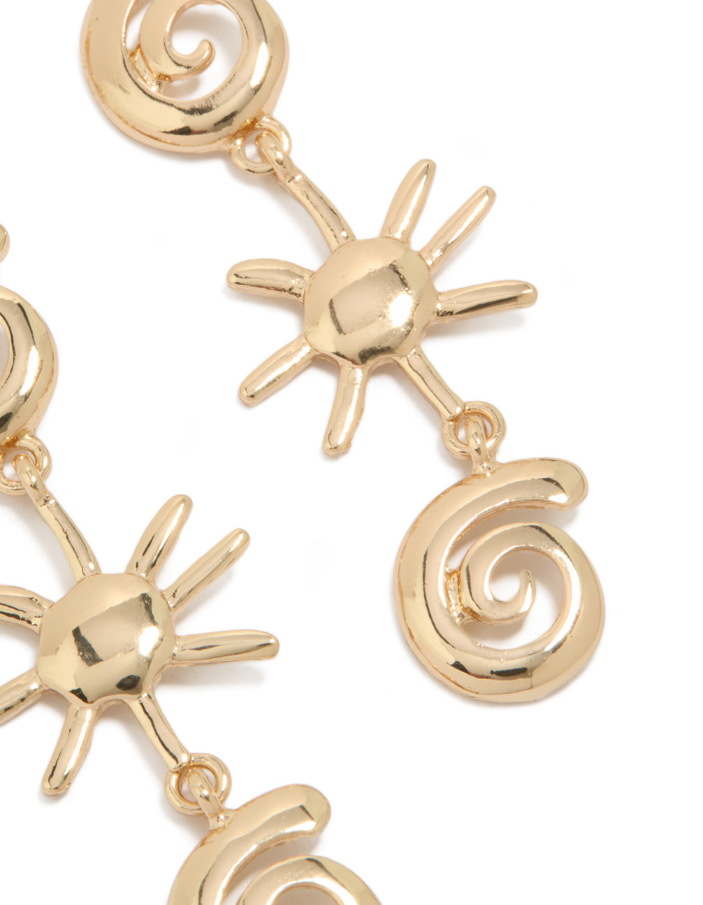 Featuring gold shell and sun drop earrings with statement celestial charm design close up view