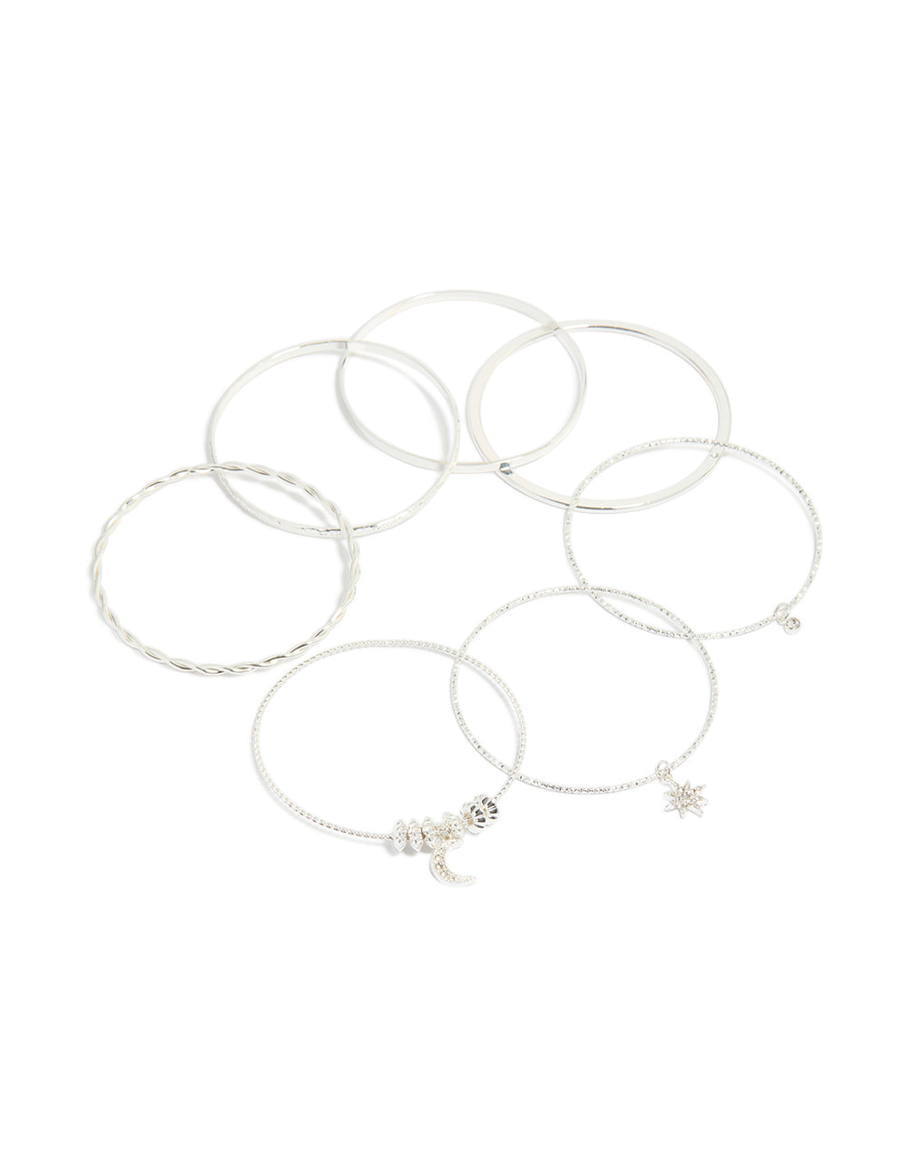 Showcasing celestial charm bangles featuring diamante moon and star accents in a statement 7-pack set front view