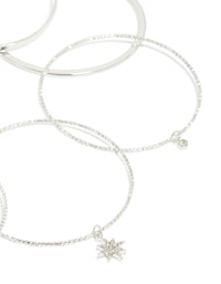 Designed with silver celestial charm bangles featuring diamante moon and star accents in a statement 7-pack set closure detail view - link has visual effect only