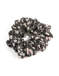 Showcasing a scattered floral printed statement scrunchie in black, light pink, beige front view - link has visual effect only