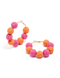 Showcasing statement hoop earrings with paper balls in hot pink, coral and gold front view - link has visual effect only