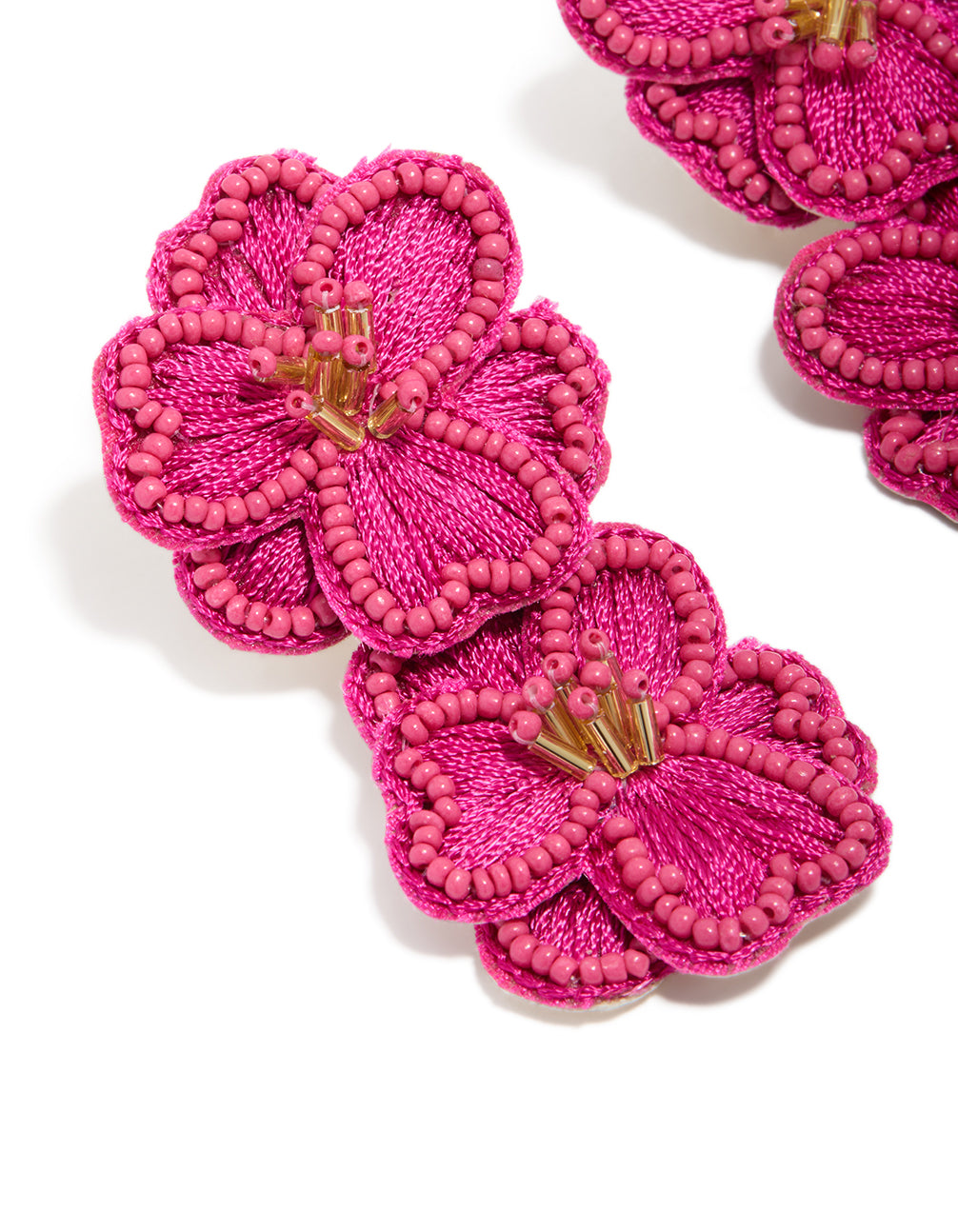 Designed with hot pink fabric beaded double flower drop earrings featuring statement design and gold accents close up view