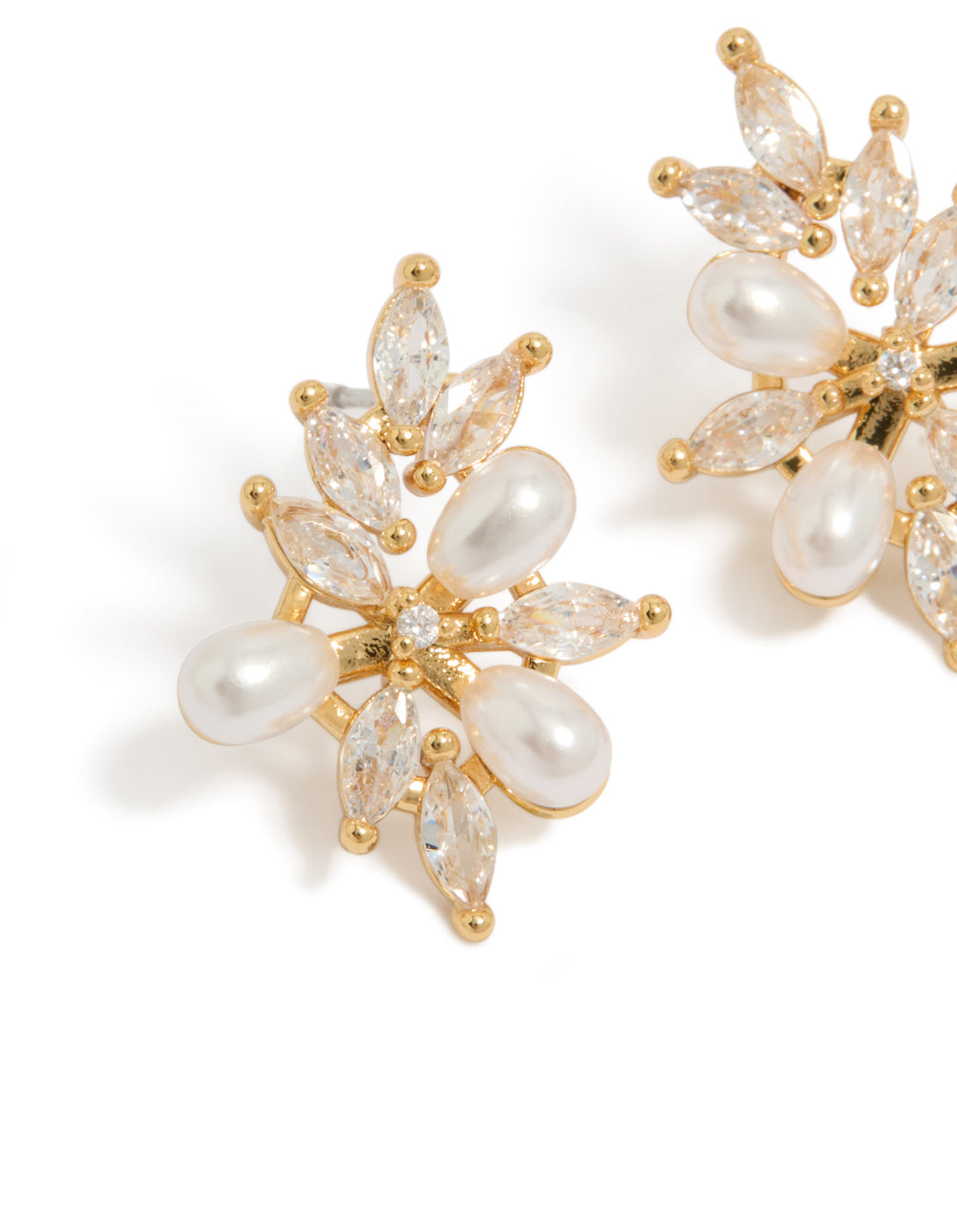 Elegant gold plated cubic zirconia organic flower and pearl earrings in statement style close up view