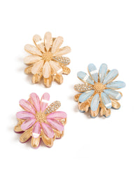 Discover glitter floral print 3-pack gold pastel daisy claw clips in pink, powder blue, and peachpuff front view - link has visual effect only
