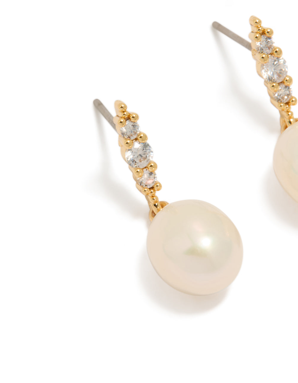 Featuring gold plated cubic zirconia and freshwater pearl drop earrings in statement style close up view