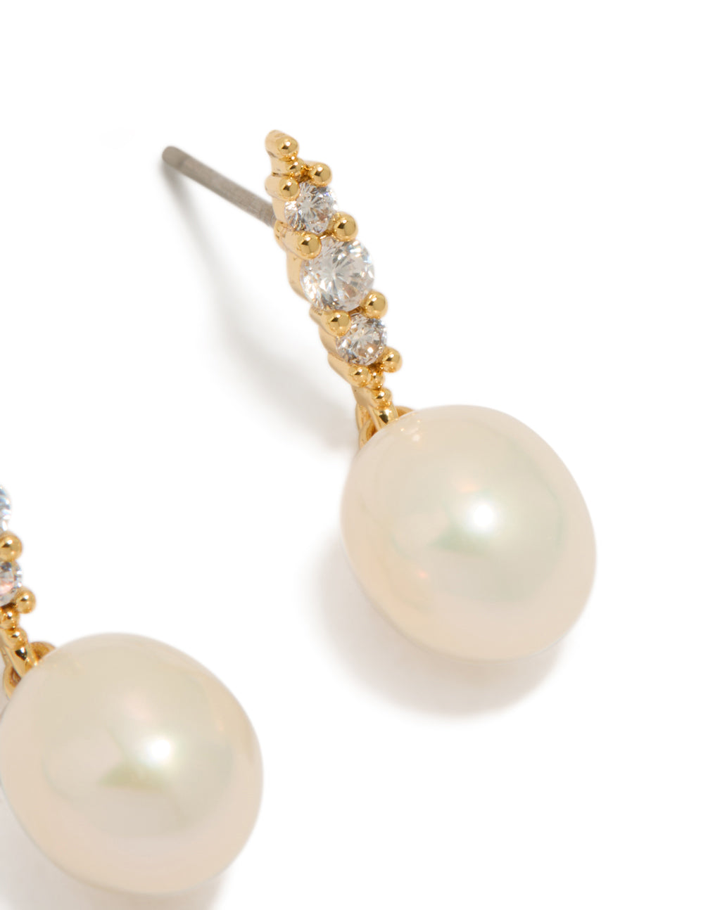 Showcasing gold plated cubic zirconia and freshwater pearl drop earrings with statement design post detail view