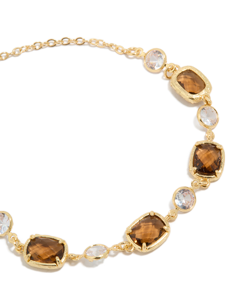 Crafted with gold plated clear and cognac cubic zirconia square cut bezel toggle bracelet close up view