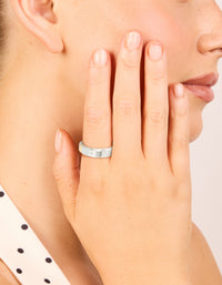 Crafted from waterproof cubic zirconia stainless steel, this spinner ring in silver and clear stone on finger view - link has visual effect only