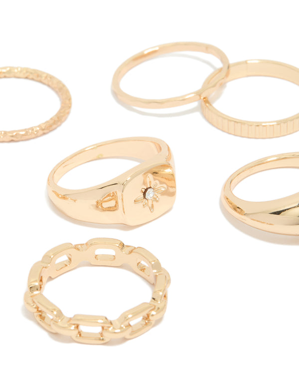 Featuring celestial star dainty gold rings in an 8-pack close up view