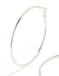 Featuring statement thin hoop earrings in waterproof stainless steel with silver finish 65 MM close up view - link has visual effect only