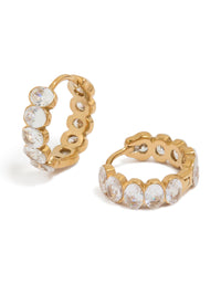Discover waterproof huggie earrings crafted from gold plated stainless steel featuring round bezel set cubic zirconias in clear front view - link has visual effect only