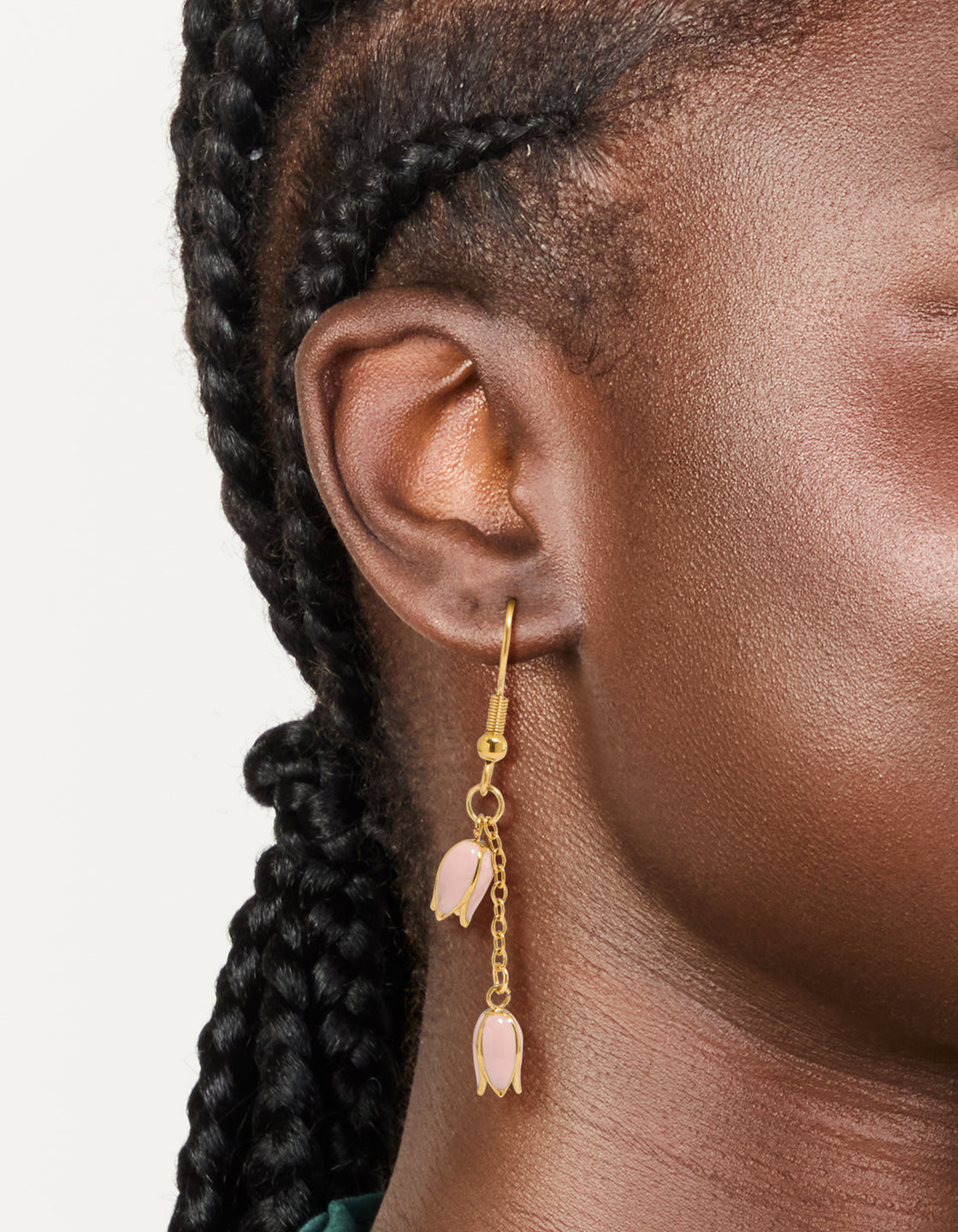 Waterproof gold plated stainless steel pink tulips drop earrings featuring floral pattern on ear view