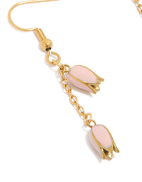 Beautifully designed waterproof drop earrings featuring pink tulips in gold plated stainless steel with charm details close up view - link has visual effect only