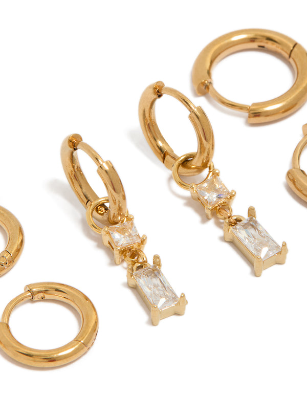 Detailed look at waterproof gold plated stainless steel huggie and stud earrings 4-pack with baguette cut cubic zirconia crystals close up view