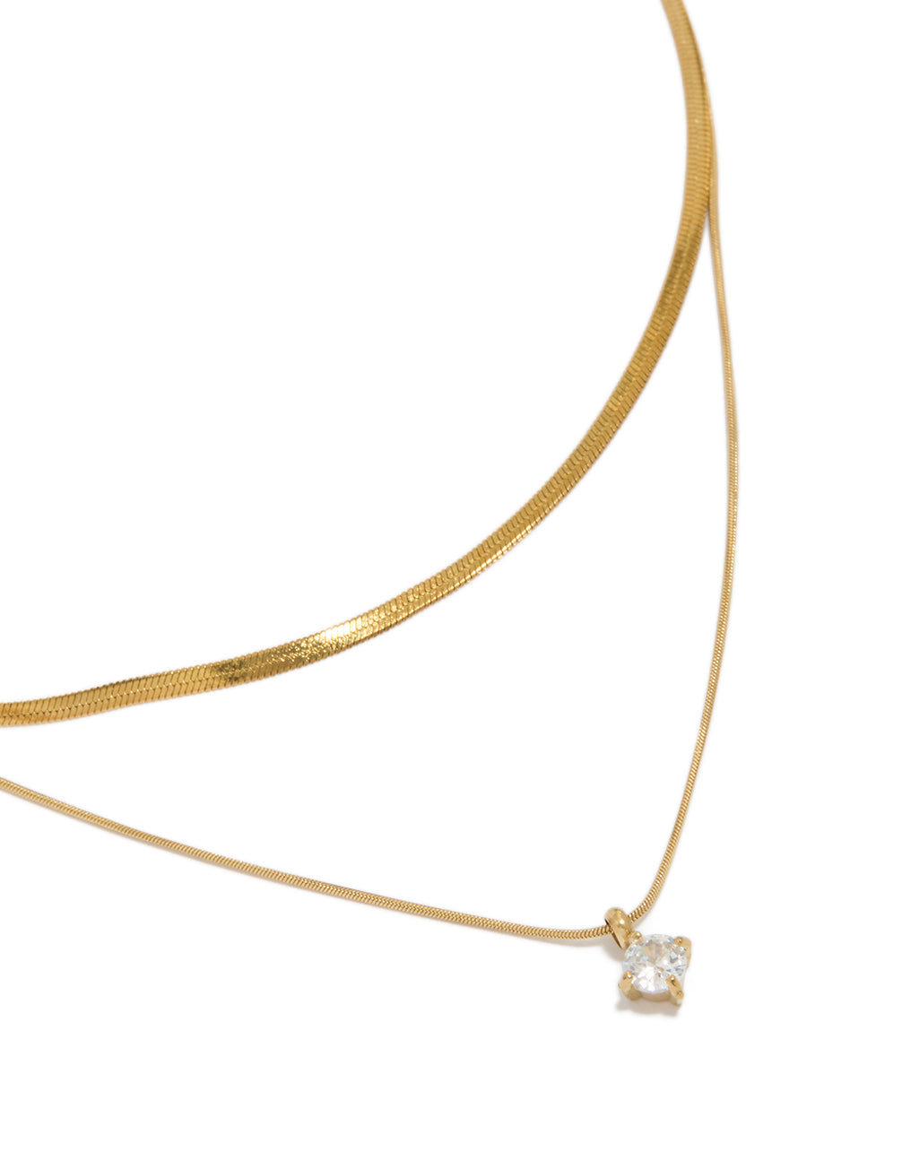 Beautifully styled waterproof layered necklace featuring a snake chain, round cubic zirconia, and a dainty gold plated stainless steel design, on neck view